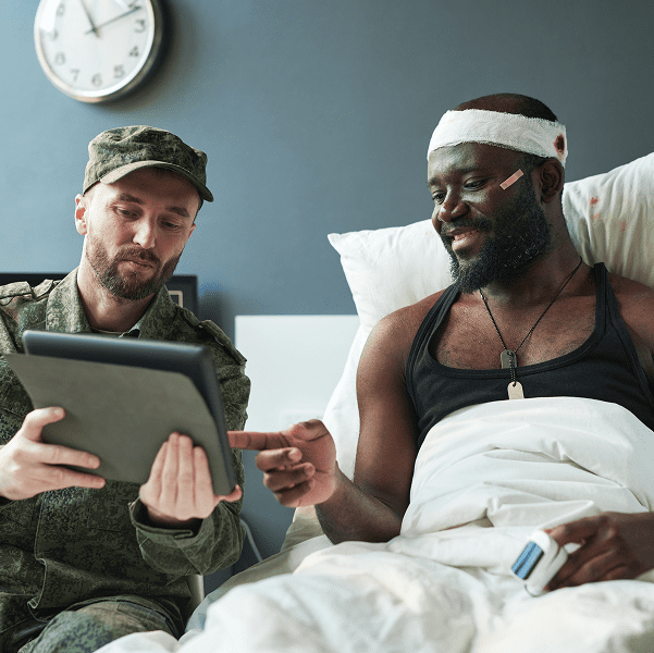 Patient and military friend with tablet