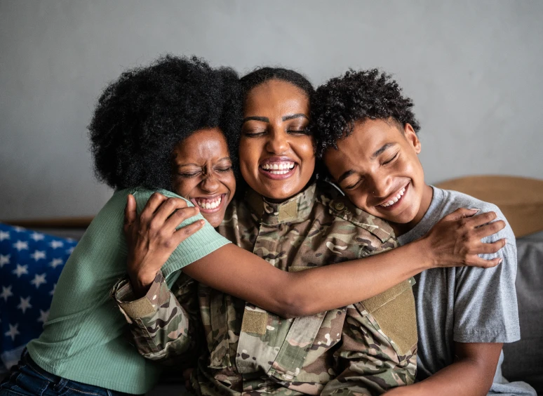 Happy family hugging tightly