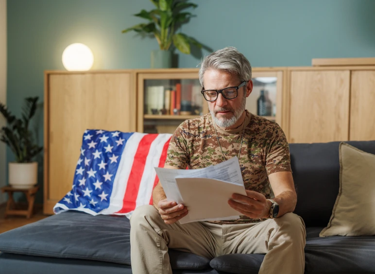 Man reading documents on a couch